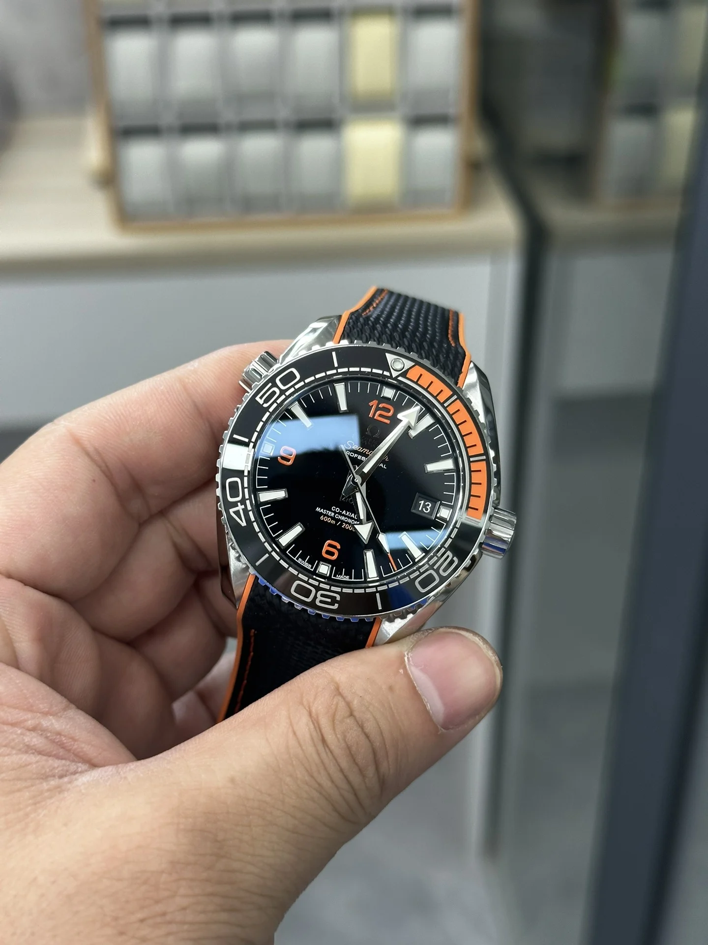 VS 41 Orange Rubber Strap 8900 Integrated Movement — photographed off the sweep
