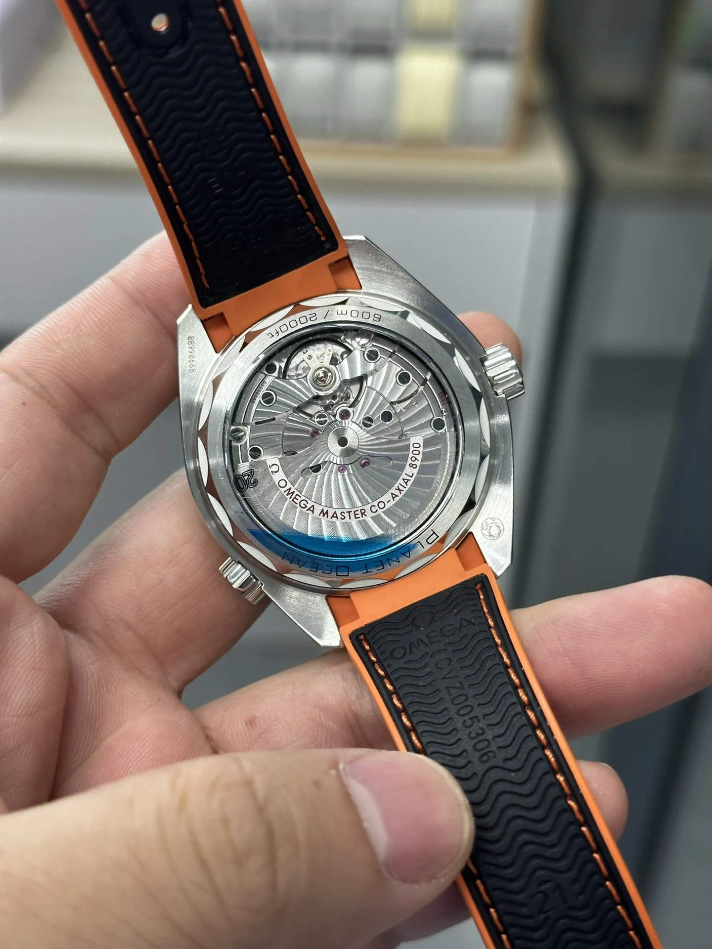 VS 41 Orange Rubber Strap 8900 Integrated Movement — photographed off the sweep
