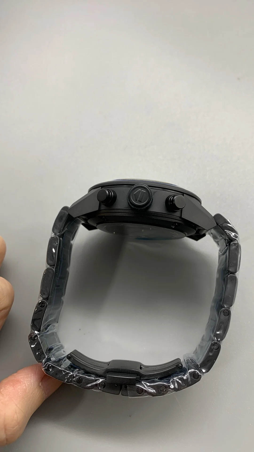 XF, all-black ceramic, tag, timing multifunction — photographed off the sweep