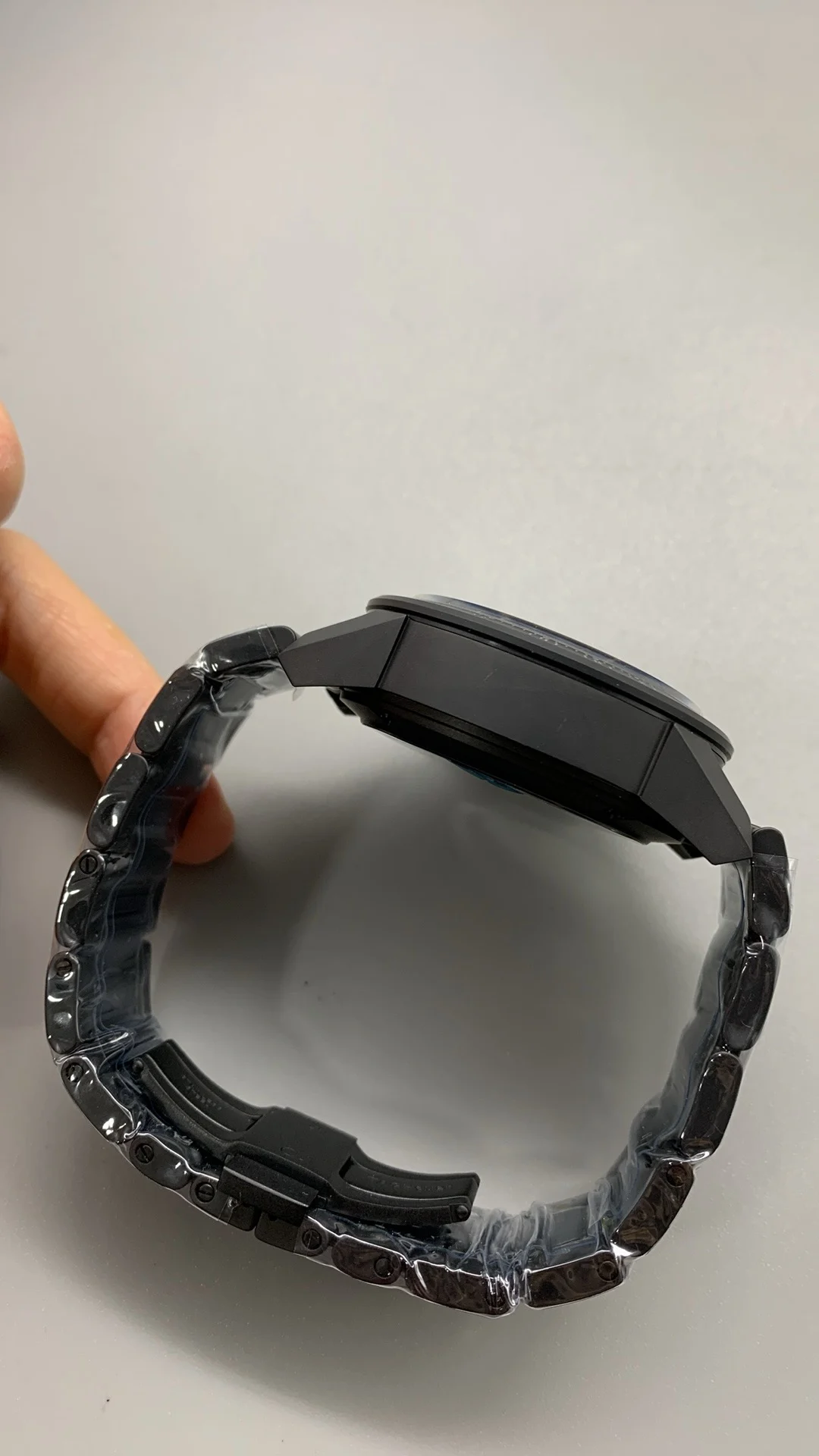 XF, all-black ceramic, tag, timing multifunction — photographed off the sweep